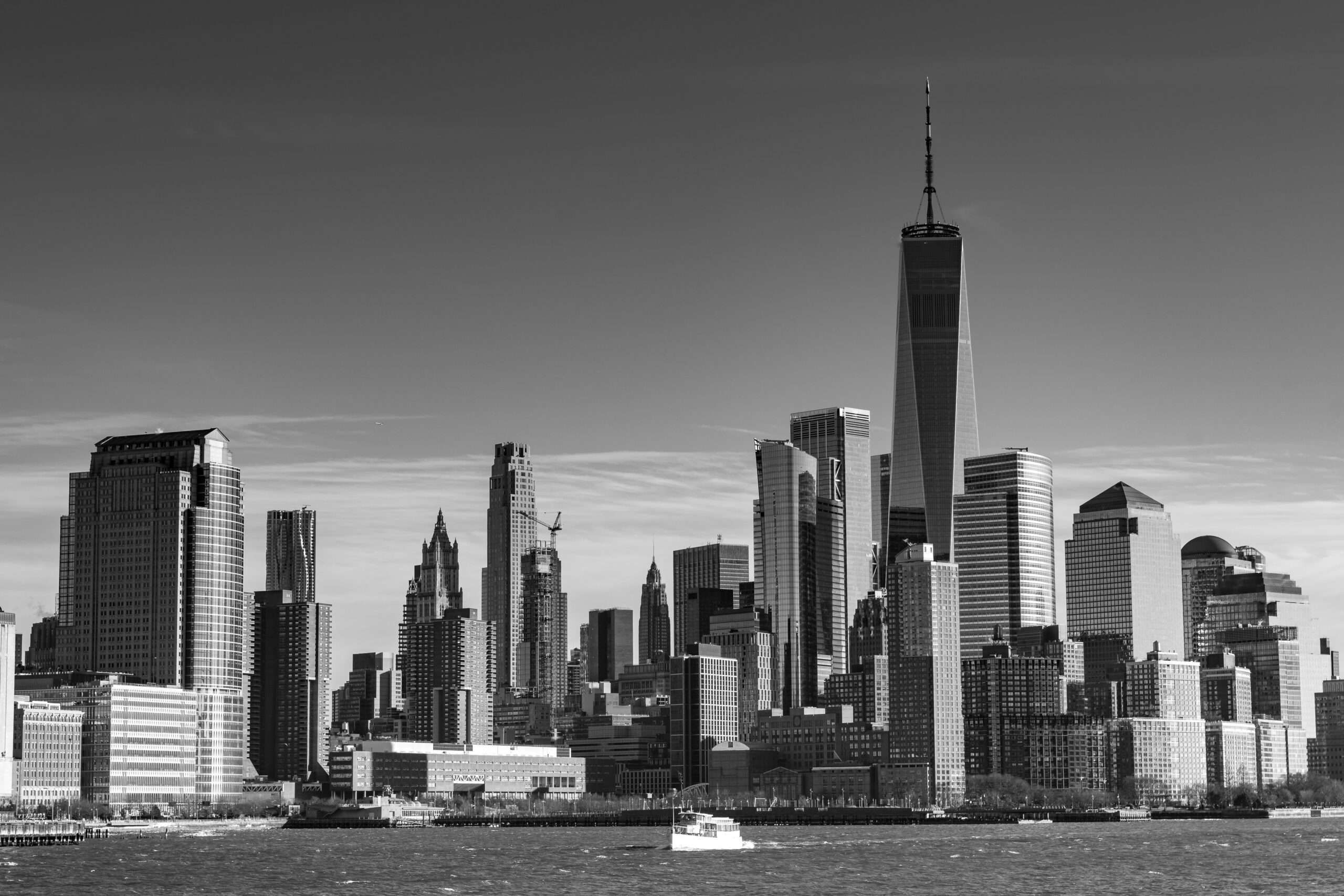 Black & white photo of Downtown New York city taken from the Hudson river